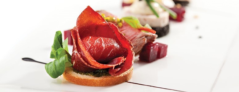 Smaller portion of meat beautifully presented Smaller portion of meat beautifully presented